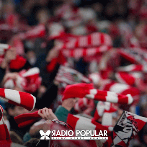 A Blurred Image Of A Crowd Of People With A Radio Popular Logo In The Corner GIF