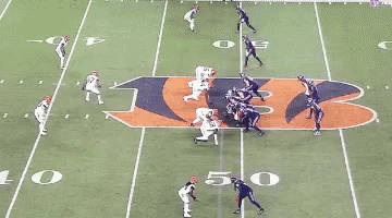 A Blurred Image Of A Football Game With A Player Wearing The Number 55 GIF