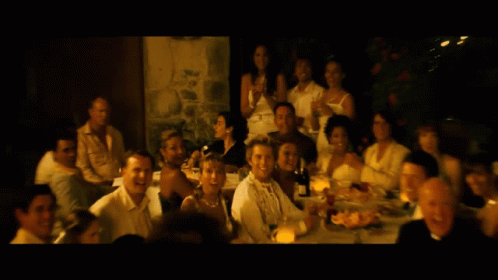 A Blurred Image Of A Group Of People Sitting At Tables GIF
