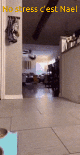 A Blurred Image Of A Hallway With The Words No Stress C'est Nael GIF