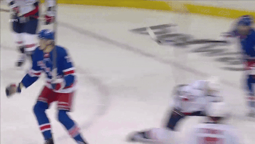 A Blurred Image Of A Hockey Game With Espn Written On The Ice GIF