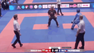 A Blurred Image Of A Karate Match Between Bulgaria And The Philippines GIF