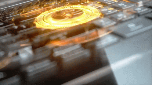 A Blurred Image Of A Keyboard With A Gold Circle In The Center GIF