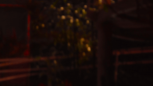 A Blurred Image Of A Light Coming Out Of A Glass GIF