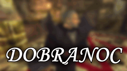 a blurred image of a man and woman with the words " dobranoc " in the foreground