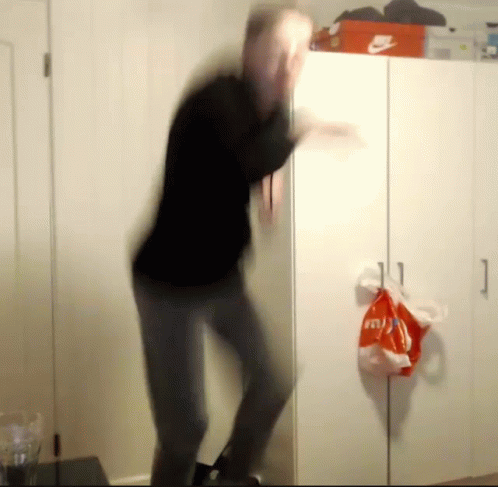 A Blurred Image Of A Man Dancing In Front Of A Nike Box GIF