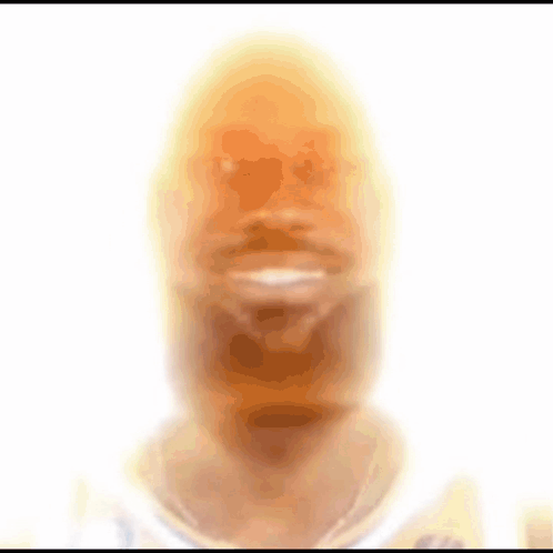A Blurred Image Of A Man 'S Face With A White Background GIF