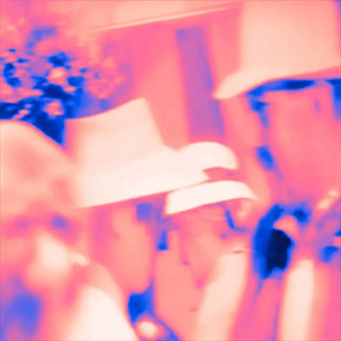 A Blurred Image Of A Man Wearing A White Hat GIF