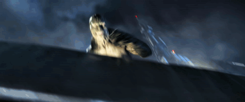 A Blurred Image Of A Monster With A Red Light In The Corner GIF