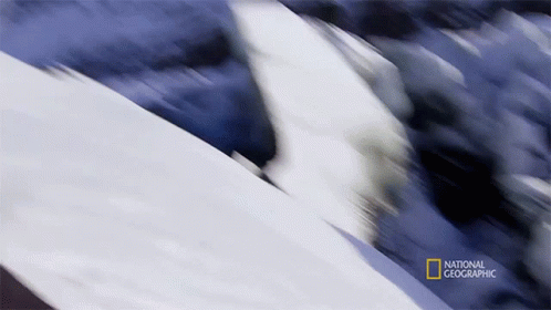 A Blurred Image Of A Mountain With The Words National Geographic In The Corner GIF