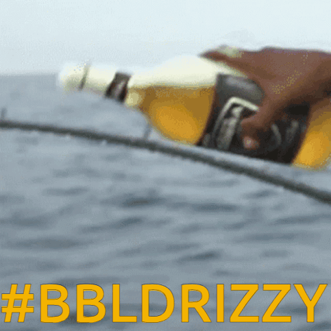 A Blurred Image Of A Person Holding A Beer Bottle With The Words #Bbldrizzy In Yellow Letters GIF