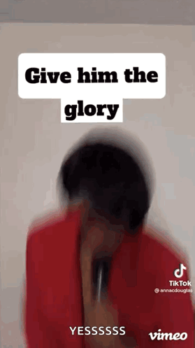 A Blurred Image Of A Person Holding A Microphone With The Words `` Give Him The Glory '' Written Above Them . GIF