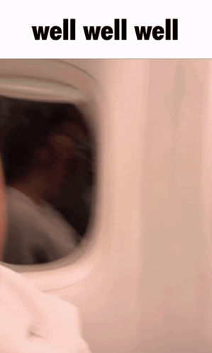 a blurred image of a person looking out of an airplane window with the words well well well above them