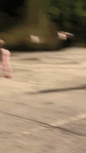 A Blurred Image Of A Person Riding A Skateboard GIF