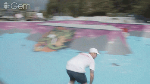 A Blurred Image Of A Person Riding A Skateboard With A Gem Logo Behind Them GIF
