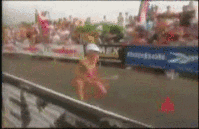 A Blurred Image Of A Person Running In Front Of A Domino 'S Banner GIF