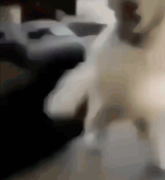 A Blurred Image Of A Person 'S Face With A Black Background GIF