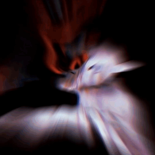 A Blurred Image Of A Person 'S Face With A Red Background GIF