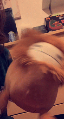A Blurred Image Of A Person 'S Head With A Box In The Background That Says ' Xbox ' On It GIF
