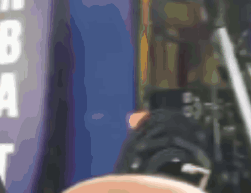 A Blurred Image Of A Person Standing In Front Of A Sign That Says Nba GIF