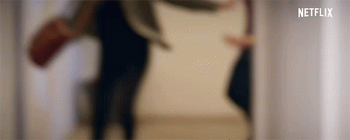 A Blurred Image Of A Person Walking Down Stairs . GIF