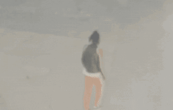 A Blurred Image Of A Person Walking On A Street GIF