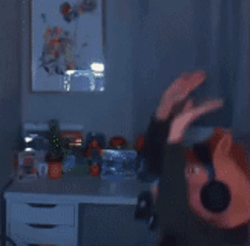A Blurred Image Of A Person Wearing Headphones And A Pig Head GIF