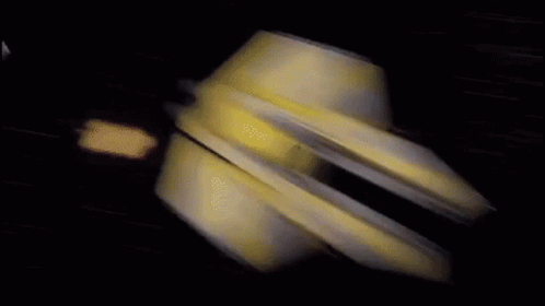 A Blurred Image Of A Plane Flying Through A Dark Blue Sky GIF