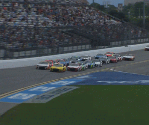 A Blurred Image Of A Race Track With A Sign That Says ' Georgia ' GIF