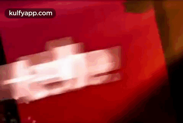 A Blurred Image Of A Red Background With The Words Kulfyapp.com On The Bottom GIF