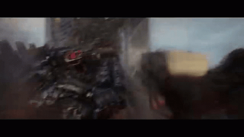 A Blurred Image Of A Robot Fighting A Monster In A Video Game . GIF