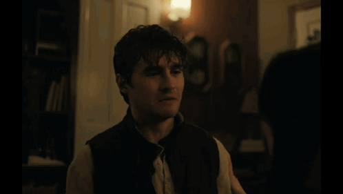 A Blurred Image Of A Room With A Lamp And Curtains GIF