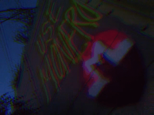 A Blurred Image Of A Sign That Says ' No Parking ' GIF