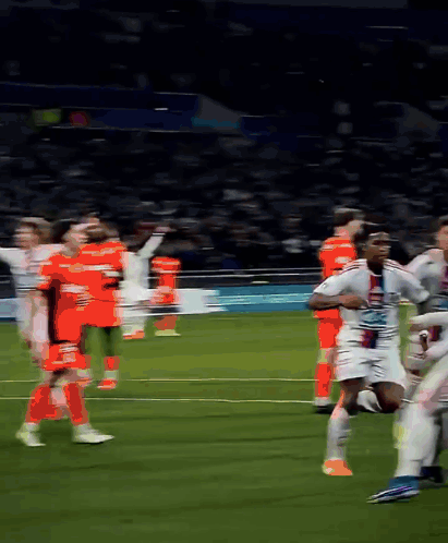 a blurred image of a soccer game with a player wearing a jersey that says ' lg ' on it