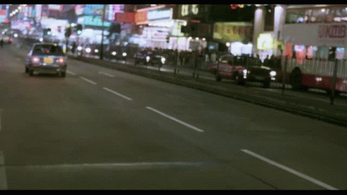 A Blurred Image Of A Street With A Sign That Says ' A ' On It GIF
