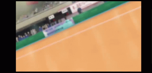A Blurred Image Of A Tennis Court With A Sign That Says ' Allianz ' On It GIF