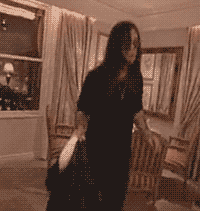 A Blurred Image Of A Woman Dancing In A Room GIF