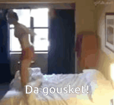 A Blurred Image Of A Woman Standing On A Bed With The Words Da Gousket Written Below Her GIF