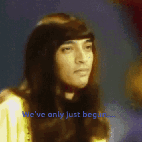 A Blurred Image Of A Woman With The Words We 'Ve Only Just Begun Below Her GIF