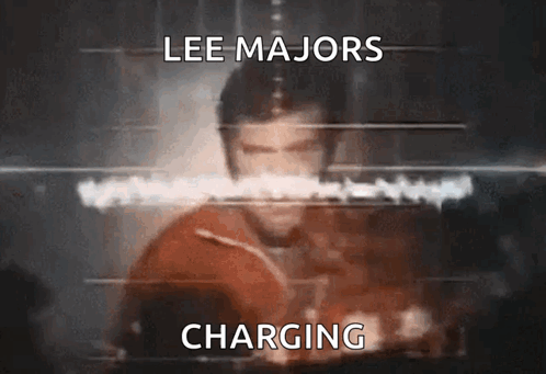 A Blurred Image Of Lee Majors Charging GIF