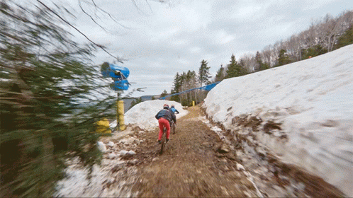 A Blurred Image Of People Walking Down A Snow Covered Path GIF