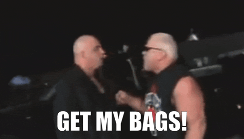 A Blurred Image Of Two Men With The Words " Get My Bags " On The Bottom GIF