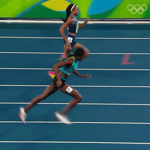 A Blurred Image Of Two Women Running On A Track With The Number 4 On The Bottom GIF