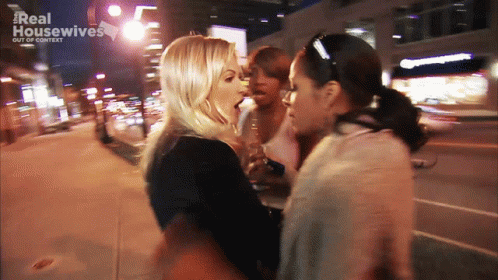 A Blurred Image Of Two Women With The Words Real Housewives Out Of Context Behind Them GIF