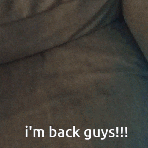 A Blurred Image With The Words I 'M Back Guys Written Below It GIF