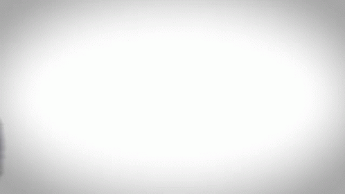 A Blurry Image Of A Man In A Blue Suit GIF