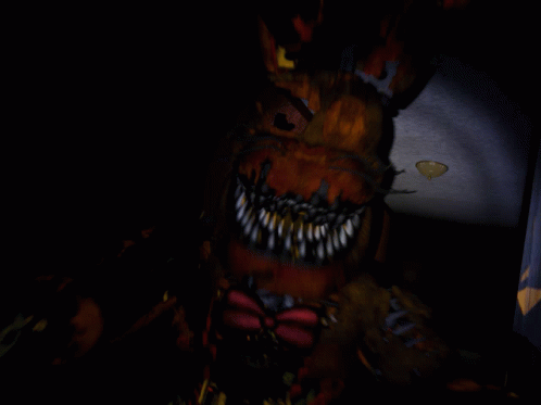 A Blurry Image Of A Monster With Sharp Teeth GIF