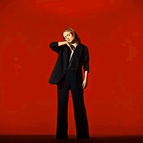 A Blurry Image Of A Person 'S Face In A Red Background GIF