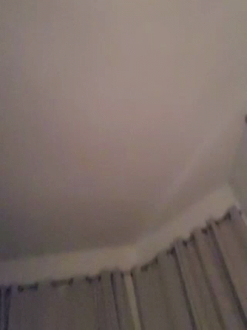 A Blurry Image Of A Person 'S Face With A Pink Background GIF