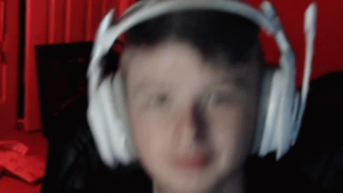 A Blurry Image Of A Person Wearing Headphones GIF